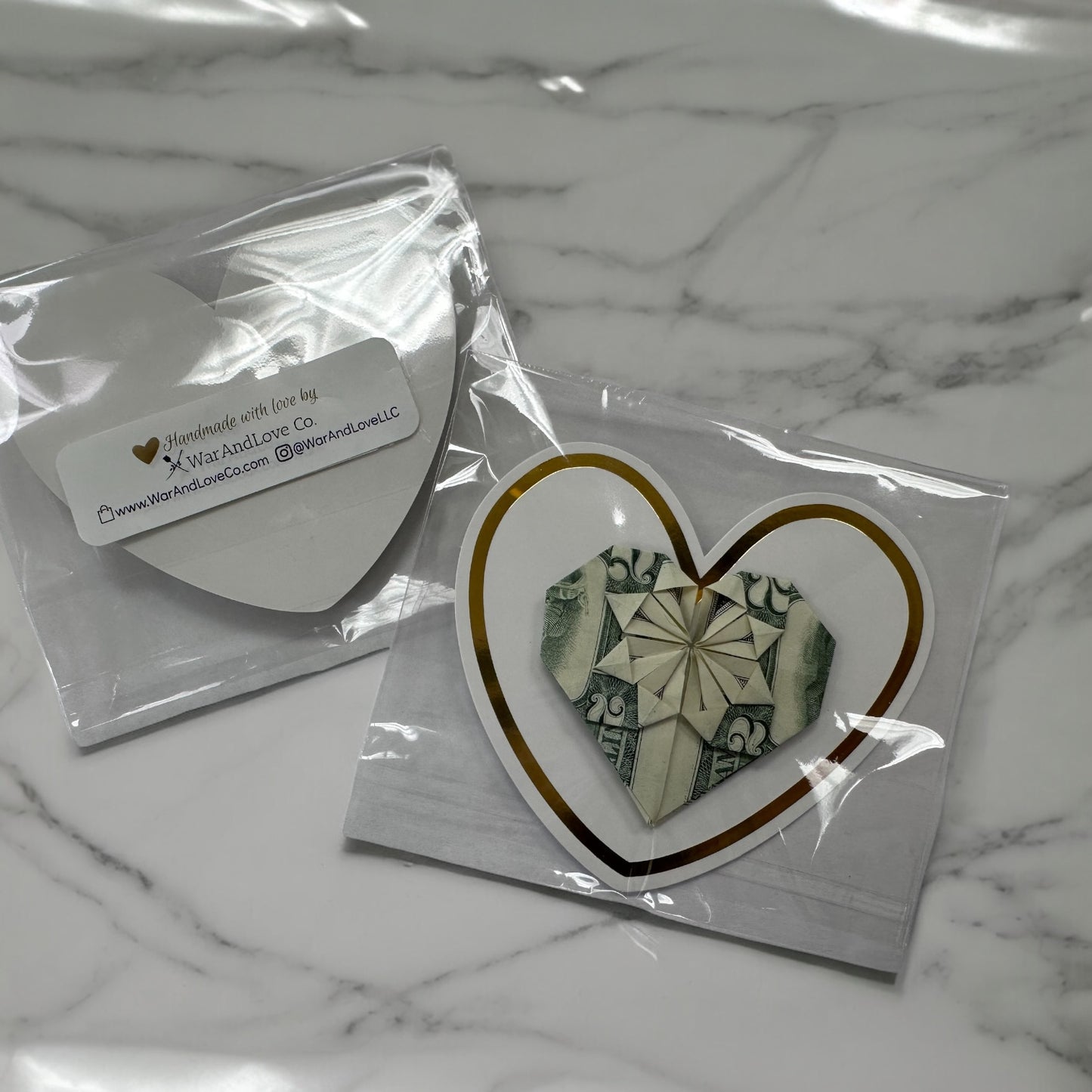MONEY ART: Origami Heart made with REAL MONEY $2 Bill (White & Gold Trim background)